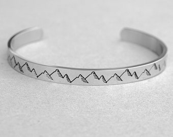 Mountain Range Engraved Outside of Cuff Bracelet, Engraved Quote Inside Cuff" The Mountains Are Calling And I Must Go". Hiker, Climber