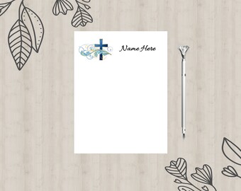 May include: A white sheet of paper with a blue and gold cross with floral accents and the text "Name Here" at the top.
