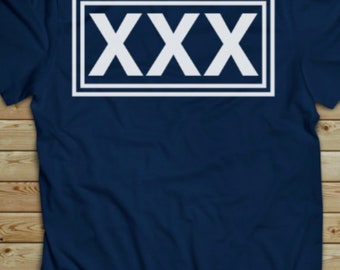 May include: A navy blue t-shirt with a white rectangular box containing the text "XXX" in white.