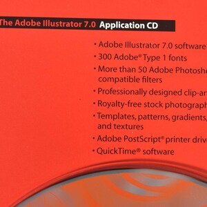 May include: Red CD case with white text that reads "The Adobe Illustrator 7.0 Application CD". The text lists the software's features, including Adobe Illustrator 7.0 software, 300 Adobe Type 1 fonts, more than 50 Adobe Photoshop compatible filters, professionally designed clip-art images, royalty-free stock photographs, templates, patterns, gradients, and textures, Adobe PostScript printer driver, and QuickTime software.