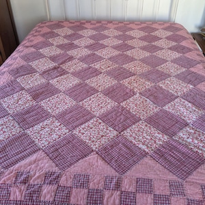 May include: A handmade, wooden serving tray with a natural finish. The tray features a rectangular shape with raised edges and integrated handles. The wood grain is visible, showcasing the tray's rustic charm. Dimensions are approximately 18 inches long, 12 inches wide, and 2 inches high.