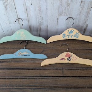 Four Vintage Painted Wood Child&#39;s Hangers, Nursery Rhyme, Little Pigs, Flopsy, Mopsy Rabbits, Dog, Yellow, Blue, Green, 1950s