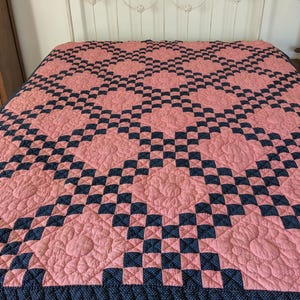 May include: A set of three ceramic mugs with a speckled, matte finish. Each mug features a different color: light blue, cream, and gray. The mugs have a simple, modern design and a comfortable handle.