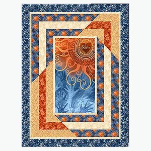 May include: A quilt block with a blue, orange, and cream color scheme. The center of the block features a sun with a heart in the center that says "Believe".