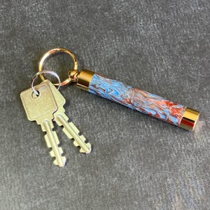 Blue and Red Marbled Keychain with Hidden Compartment Good for Use as Needle Case, Toothpick Holder, or Pill Case