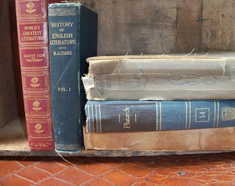 May include: A stack of vintage hardcover books with blue, brown, and white covers. The titles on the books are "World's Greatest Literature", "History of English Literature", "With the Wind", and "Plutarch".