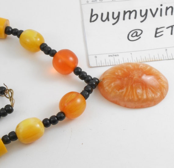 Large statement necklace featuring Molded plastic… - image 3