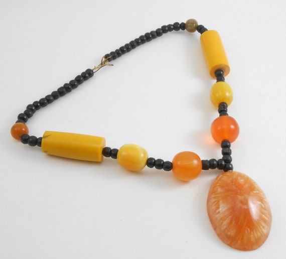 Large statement necklace featuring Molded plastic… - image 5