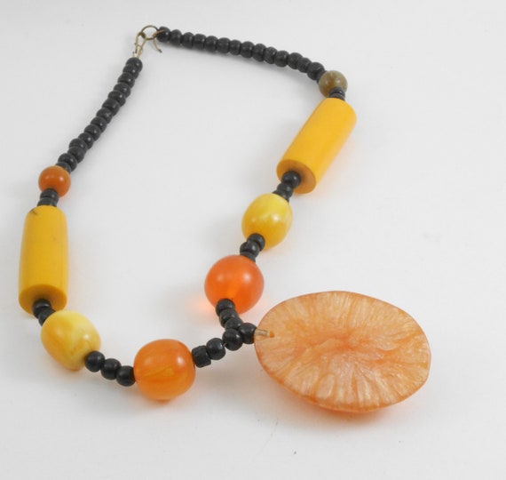 Large statement necklace featuring Molded plastic… - image 4