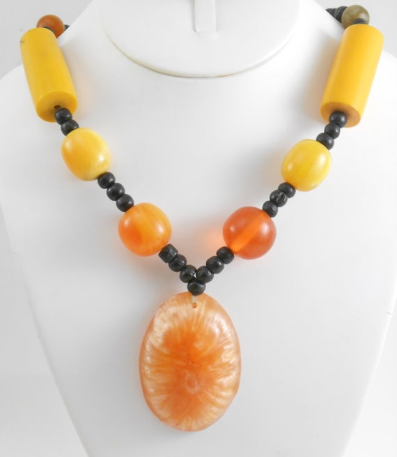 Large statement necklace featuring Molded plastic… - image 1