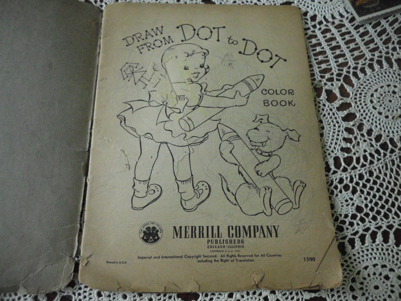 May include: A vintage "Draw From Dot to Dot" coloring book with a black and white illustration of a girl and a dog holding crayons. The book cover has the title "Draw From Dot to Dot" and "Color Book" printed in black text. The book is published by Merrill Company, Chicago, Illinois.