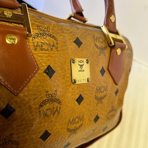 MCM  Boston Cignac Visetos Satchel MCM Handbag Top Handle Bag Cognac Visetos 2 way bag Top handle Wide Crossbody Shoulder Bag Strap