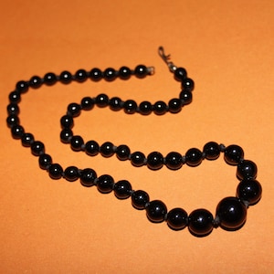 Art Deco black glass beaded knotted necklace. Length 16 inches/Classic