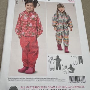 May include: A Burda Kids sewing pattern featuring two children's outfits: a red floral jacket and pants set, and a patterned jumpsuit. The pattern includes diagrams and the text "ALL PATTERNS WITH SEAM AND HEM ALLOWANCES".