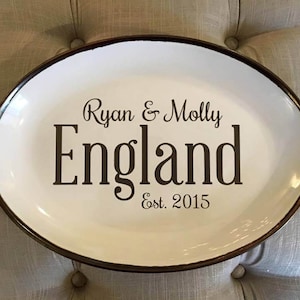 May include: White oval serving platter with a black rim and the text "Ryan & Molly England Est. 2015" printed in black.