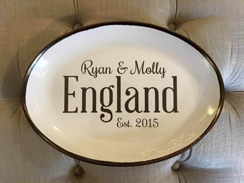 May include: White oval serving platter with a black rim and the text "Ryan & Molly England Est. 2015" printed in black.