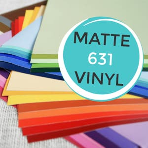 May include: A stack of colorful vinyl sheets in various shades of red, orange, yellow, green, blue, and purple. The sheets are labeled "Matte 631 Vinyl".
