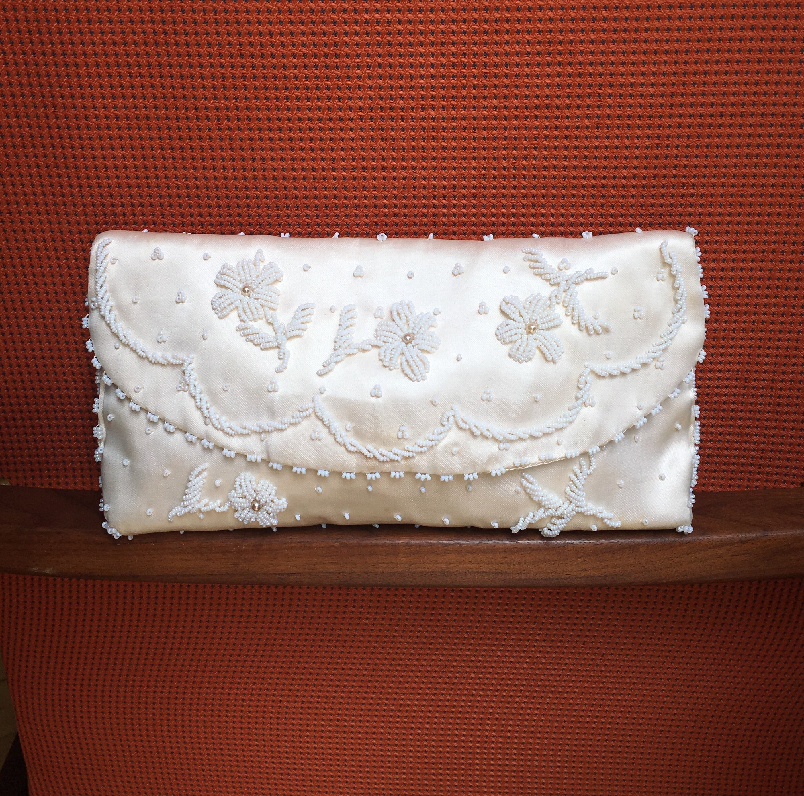 cream satin clutch bag