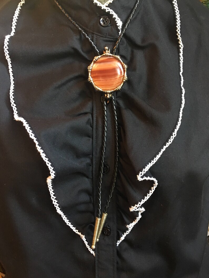 Western Orange Round Agate with Gold Metal Frame Black Cord and Brass Metal Tips