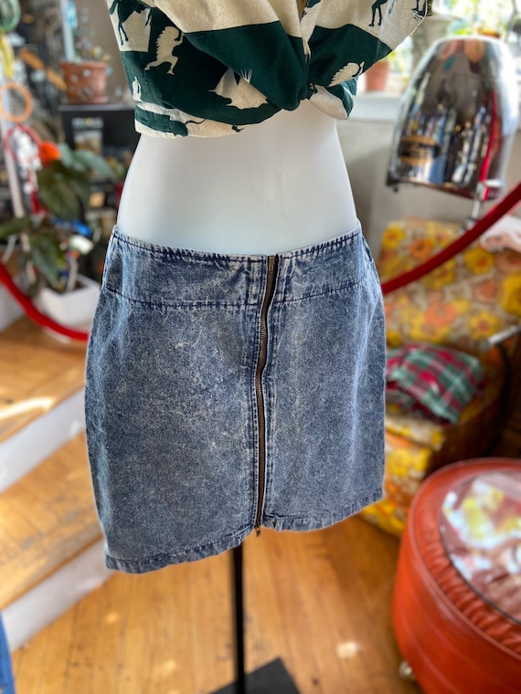 Acid wash or stonewash denim zip front skirt