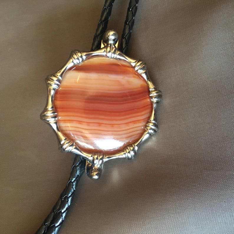 Western Orange Round Agate with Gold Metal Frame Black Cord and Brass Metal Tips