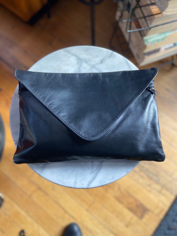 Oversized, leather clutch purse
