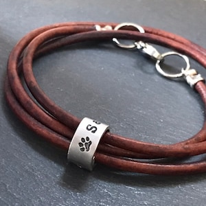 Personalized leather pet bracelet with ring charms with pawprint and custom name