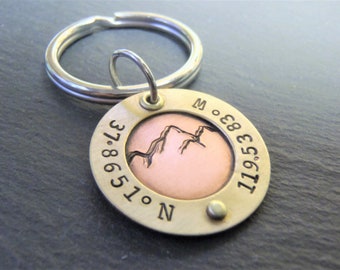 Personalized mountain keychain with hand stamped custom coordinates. traveling keychains. gift for hiker