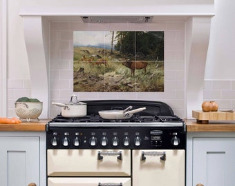 May include: A white kitchen with a black and cream range cooker. The backsplash is tiled with a scenic image of a forest with deer. The range has a digital clock that reads 07:30.