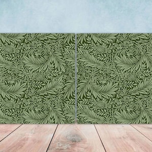 May include: Two green patterned fabric panels with a floral design. The panels are side by side and have a white background.