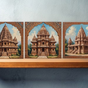 May include: Three framed paintings of intricately detailed Indian temples with ornate archways and colorful backgrounds.
