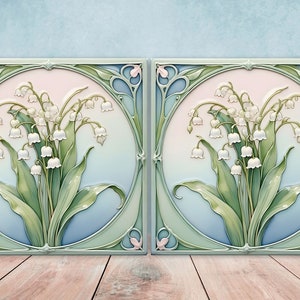 May include: Two square ceramic tiles with an Art Nouveau design featuring white lily of the valley flowers in a green and blue background.