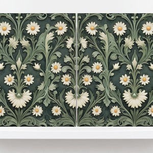 May include: Panel with a repeating floral design of white daisies with yellow centres and green leaves on a dark teal background. The symmetrical pattern creates a classic, elegant look. The panel is displayed on a white shelf.