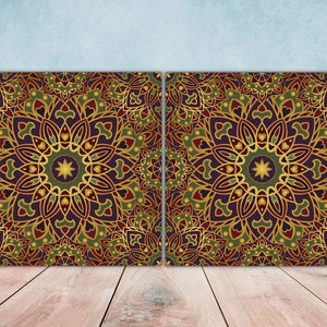 May include: Two square canvases featuring a repeating pattern of gold, green and purple mandala designs.