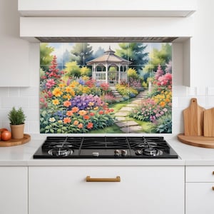 May include: A vibrant floral garden scene with a white gazebo, printed on tiles. The artwork depicts a stone pathway leading to the gazebo, surrounded by colorful flowers in shades of red, yellow, orange, and purple. The background includes trees and a blue sky.