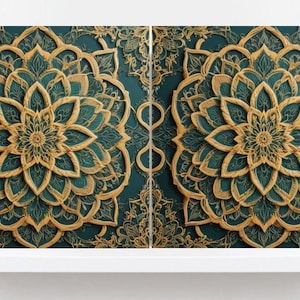 May include: Two gold and teal mandala designs with intricate details. The mandalas are symmetrical and have a floral pattern.