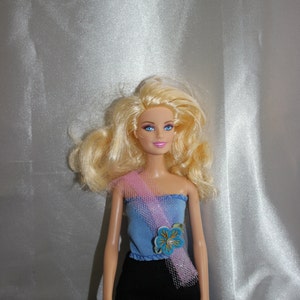 Blue top with flower for Barbie doll