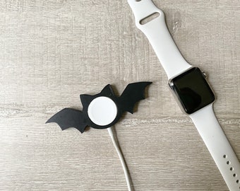 Bonita funda de murciélago para el cargador del Apple Watch