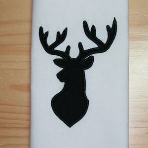 May include: Black silhouette of a deer head with antlers on a white background.