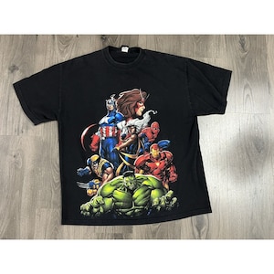 May include: Black t-shirt with a graphic print of Marvel superheroes including Hulk, Iron Man, Wolverine, Spider-Man, Captain America, and Storm.