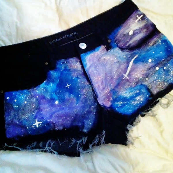 High waist galaxy shorts- black background with purple, blue, and silver star dust hand painted on the front