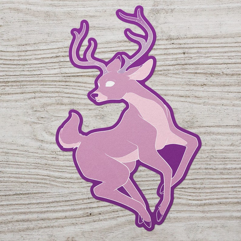 May include: A purple deer sticker with a pink body and white eyes. The deer has large antlers with a white starry pattern.