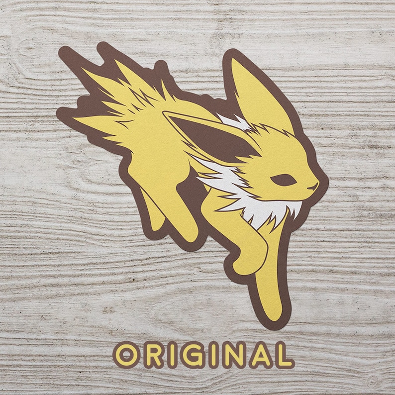 May include: A yellow and brown cartoon illustration of a fox-like Pokemon character with a white fluffy tail and a brown ear. The character is running and the word "ORIGINAL" is printed below the character.