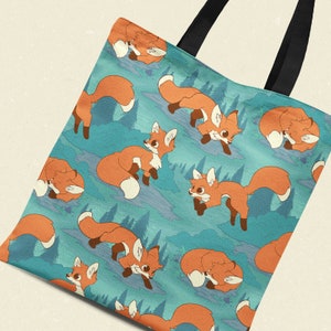 May include: A blue tote bag with a repeating pattern of orange foxes in a forest setting. The foxes are in various poses, including sleeping, walking, and sitting.