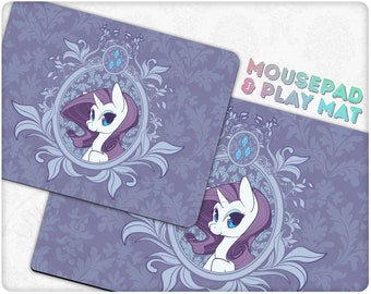 May include: Purple and blue mousepad and play mat with a white unicorn with a purple mane and tail in a decorative frame. The text "MOUSEPAD & PLAY MAT" is in the top right corner.
