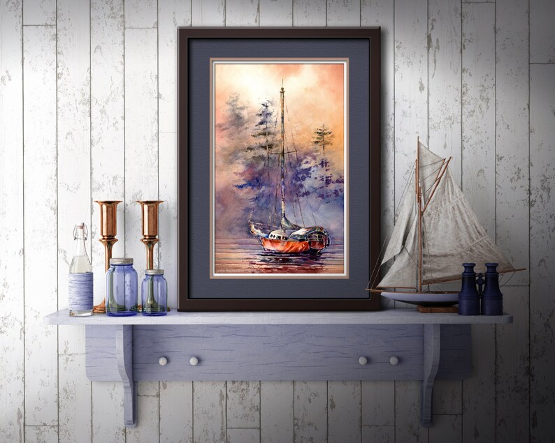 May include: A framed watercolor painting of a sailboat in a misty harbor. The sailboat is red and white with a brown mast. The background is a soft blue and purple with a hint of orange.