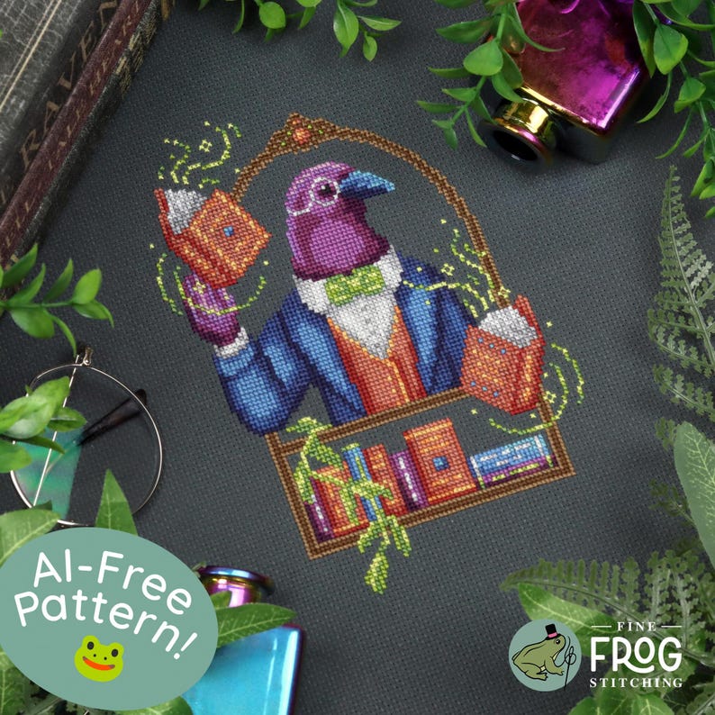 May include: A cross-stitch pattern on dark fabric featuring a purple bird wearing a blue jacket, orange vest, and green bow tie. The bird holds an open book with magical sparkles, while a bookshelf sits below. Text reads AI-Free Pattern.