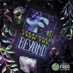 May include: Cross stitch pattern featuring a purple and green creature with the text "Creatures from the Beyond" and a price tag of $1.