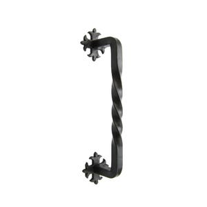 May include: Black metal door pull with a twisted design and decorative cross-shaped ends.