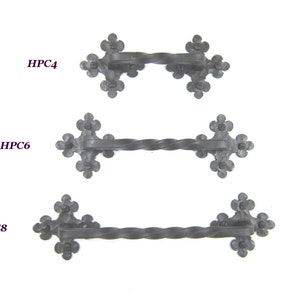 May include: Three black metal door pulls with a twisted design and a decorative fleur-de-lis shape at each end. The pulls are labeled HPC4, HPC6, and HPC8.